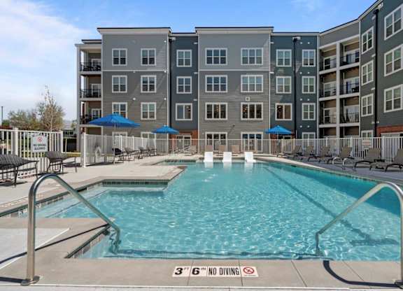 A pool with a 3'6" no diving sign in the middle.