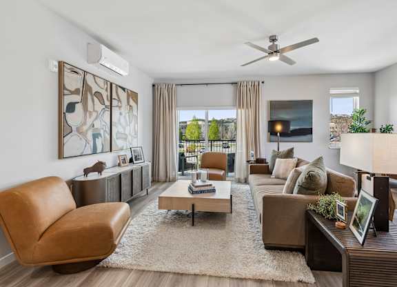A living room with a brown leather chair and a coffee table.