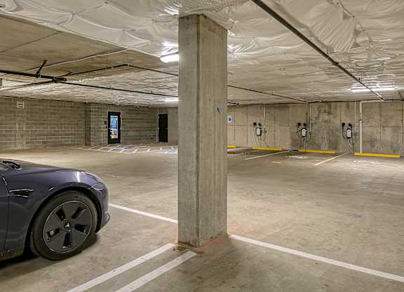 a parking garage with a car parked in it