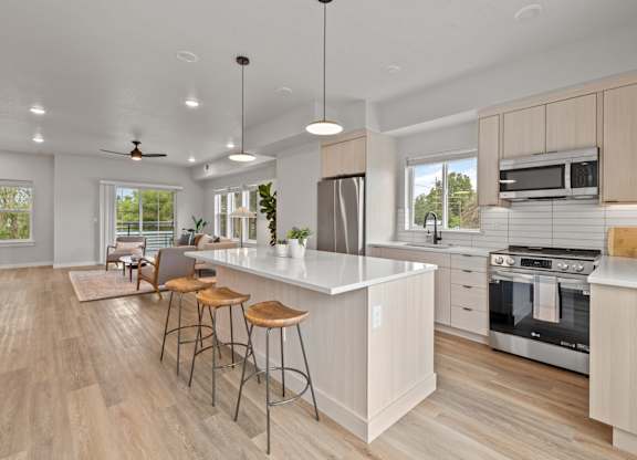 Alpine Landing Townhomes in Garden City, Idaho Model Kitchen with Large Island and Living Room