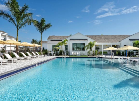 Altair by Soltura Clubhouse Exterior and Pool with Lounge Chairs
