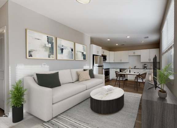 A modern living room with a white couch and a grey rug.