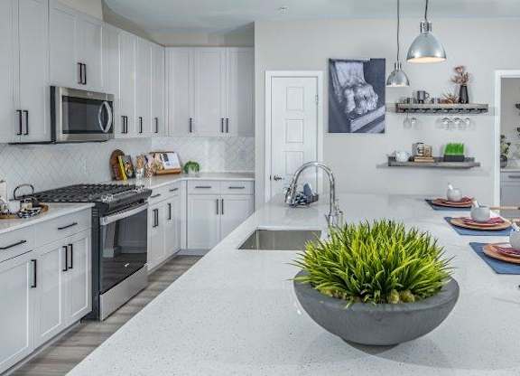 Alton Southern Highlands Apartments in Las Vegas, Nevada Model Kitchen with Large Island and Living Room