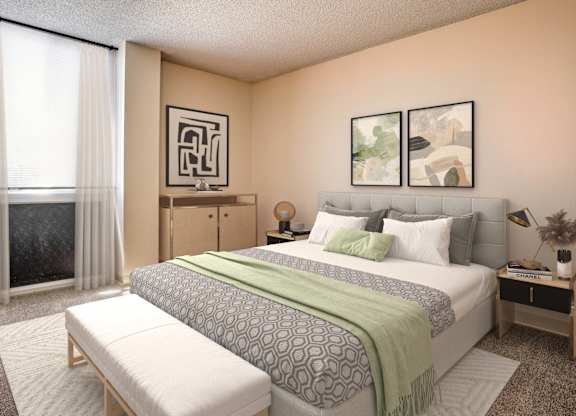 A bedroom with a large bed, a bench, and two pictures on the wall.