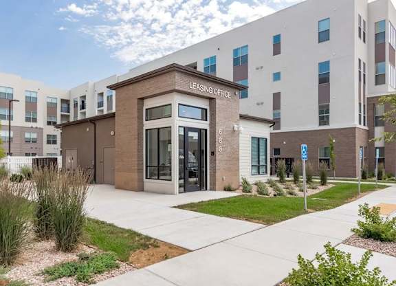 A building with a glass door and a sign that says
