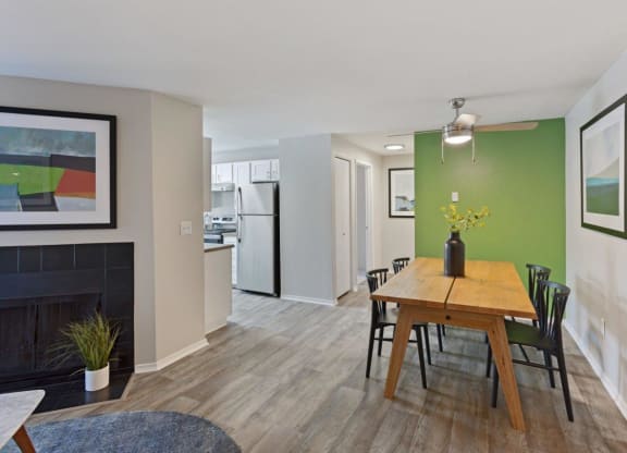 Alvista 23 Apartment Homes Model Living Room with Fireplace and Dining Area