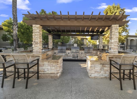 Estancia at Mission Grove Apartments Grilling Area with Bar Seating