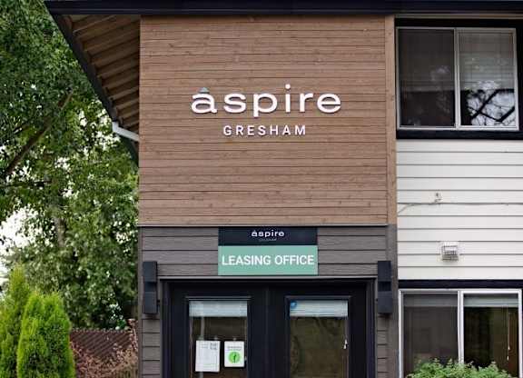 The Aspire Leasing Office is located in a building with a modern design.