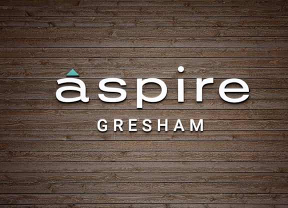 A logo with the word "aspire" and the word "Gresham" below it.