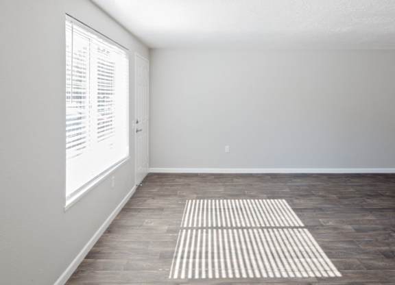 A room with a striped rug on the floor.