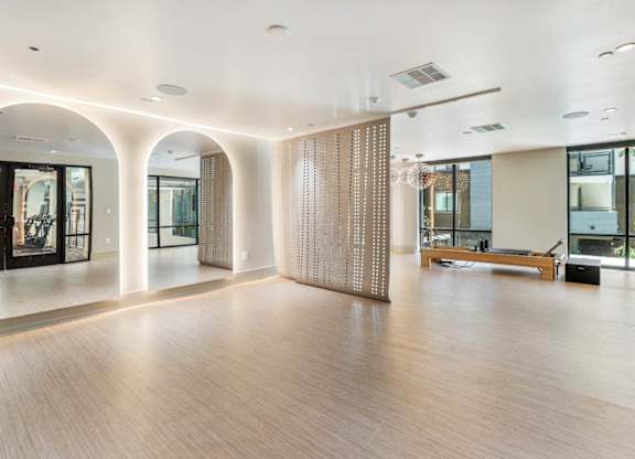 A fitness studio with open space and mirrors