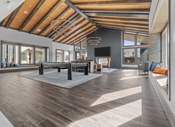 a large living room with a pool table