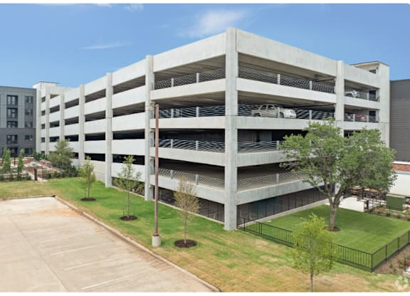 A parking garage with cars parked in it.