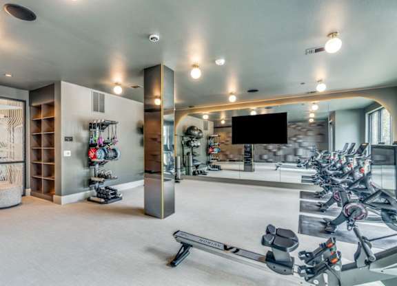 A spacious gym with a variety of exercise equipment.