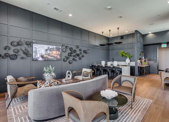 A modern living room with grey and brown furniture.