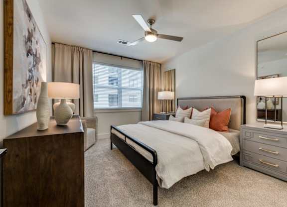 A bedroom with large windows