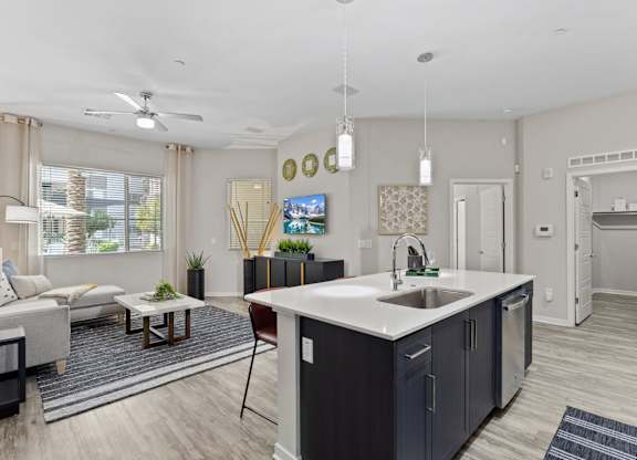 Axis Camelback Apartments in Phoenix, Arizona Model Kitchen with Island and Living Room