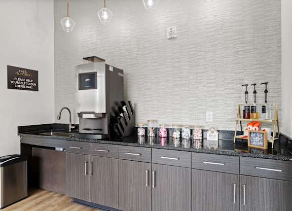 A coffee shop with a counter and a coffee machine.