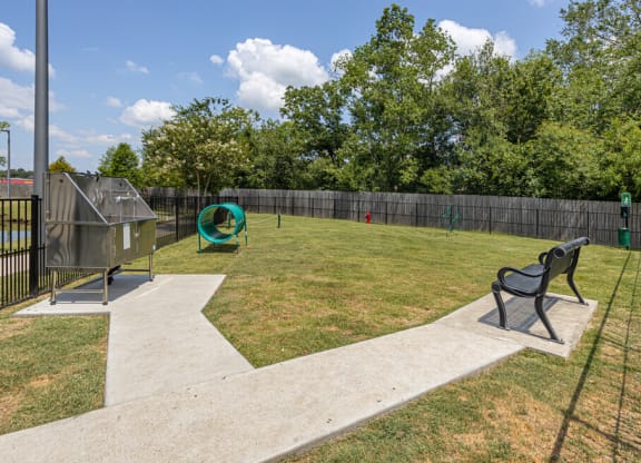 our apartments showcase a dog park with kennel and agility course
