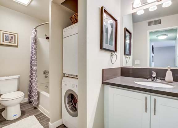 The Alexandar Apartments Bathroom with Washer and Dryer
