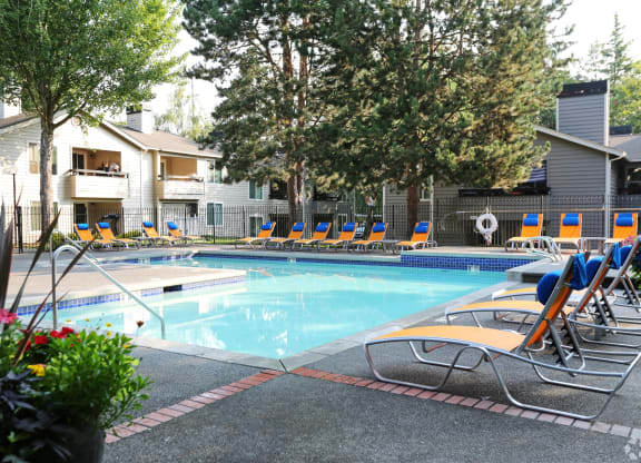 Fulton's Crossing and Landing Apartments resort style pool with lounge chairs
