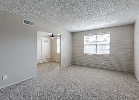 A room with a window and a door in it.