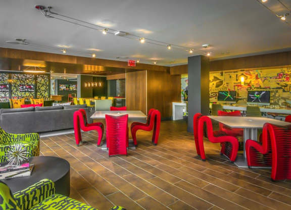 A room with a wooden floor and a mural on the wall.