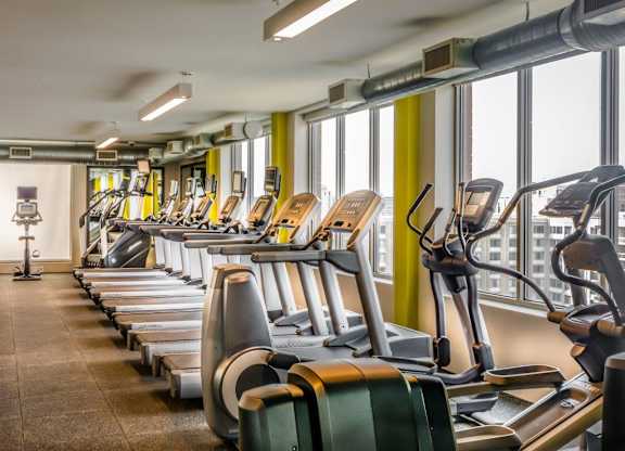 A fitness center with cardio equipment