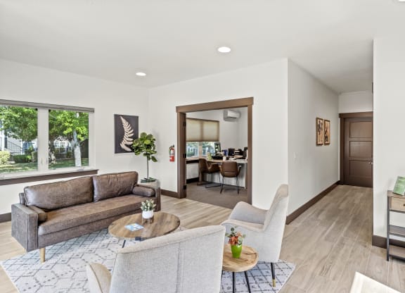 a living room with a couch and two chairs