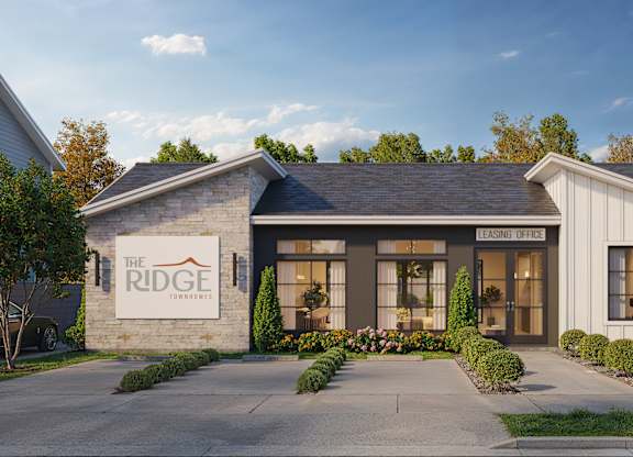 The Ridge Leasing Office is a modern building with a welcoming entrance.