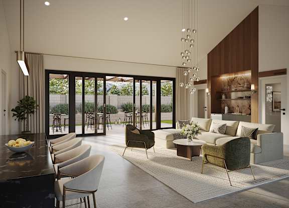 A modern living room with a bar area and a view of the backyard.