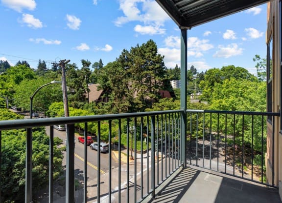 Private balcony with nature view at Collins Circle apartments in the Goose Hollow district in Portland, Oregon.