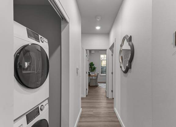 A modern laundry room with a washer and dryer.