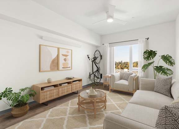 A living room with a white couch, a wooden coffee table, and a painting on the wall.