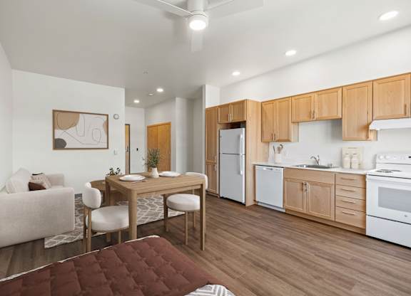 A kitchen with wooden cabinets and white appliances.