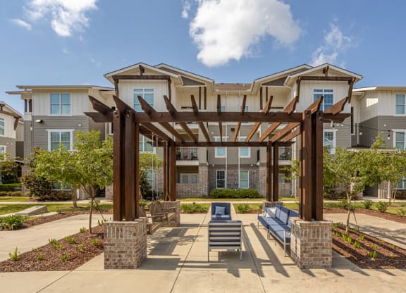 a pergola and lounge area at the bradley braddock road station apartments