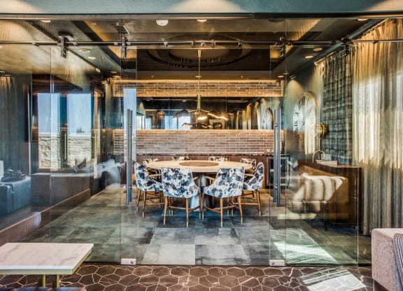 a dining room with a long table in the middle of it