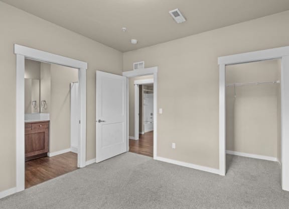 Dakota Flats Apartments in Spokane, Washington Bedroom with Attached Bathroom and Walk-In Closet