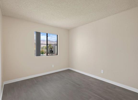 Empty room with a window and a door.