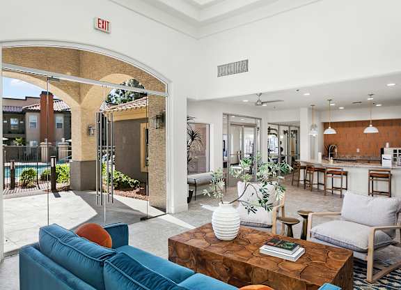 A living room with a blue couch and a coffee table.