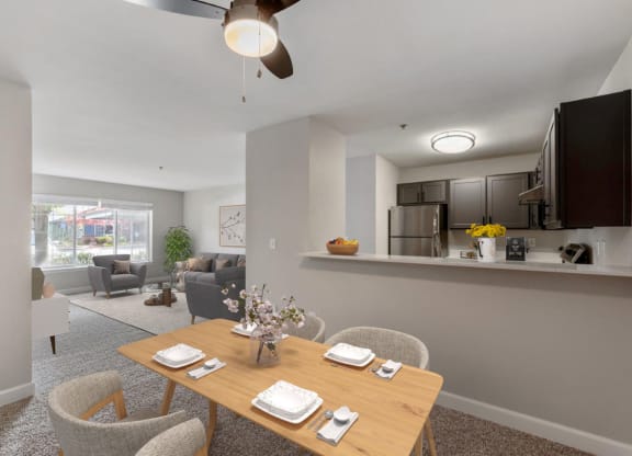 an open living room and dining room with a table and chairs
