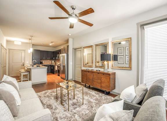 Living Room With Ceiling Fan at Discovery at The Realm, Texas