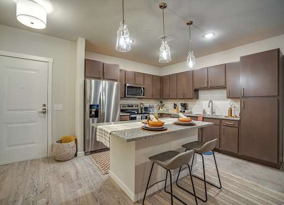 Kitchen with Island at Discovery at The Realm, Texas