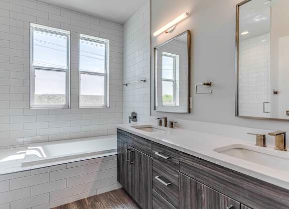 Bathroom with Double Vanity at Discovery at The Realm, Texas
