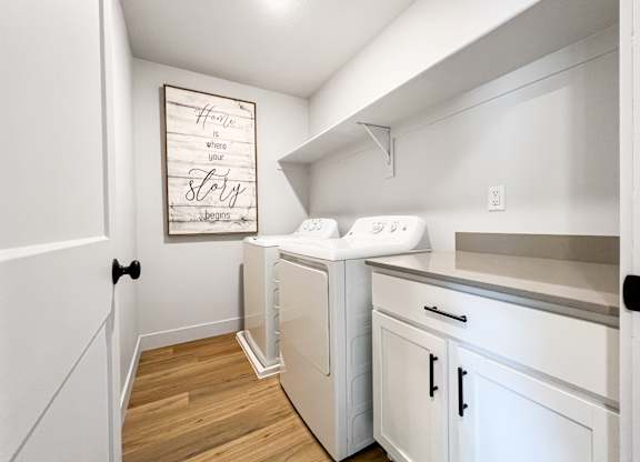 A laundry room with a washer and dryer.