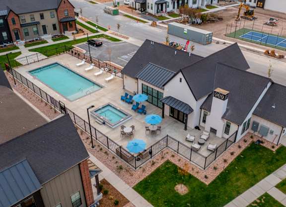 A large house with a pool in the backyard.