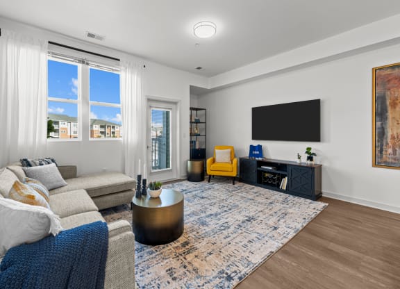 a living room with a couch and a tv