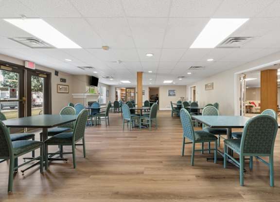 A room with tables and chairs.