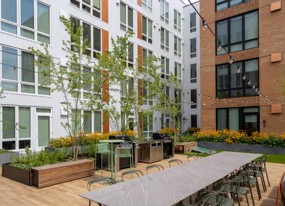 The Warren Apartments communal patio with dining area