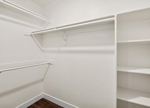 Empty white shelves in a room.
